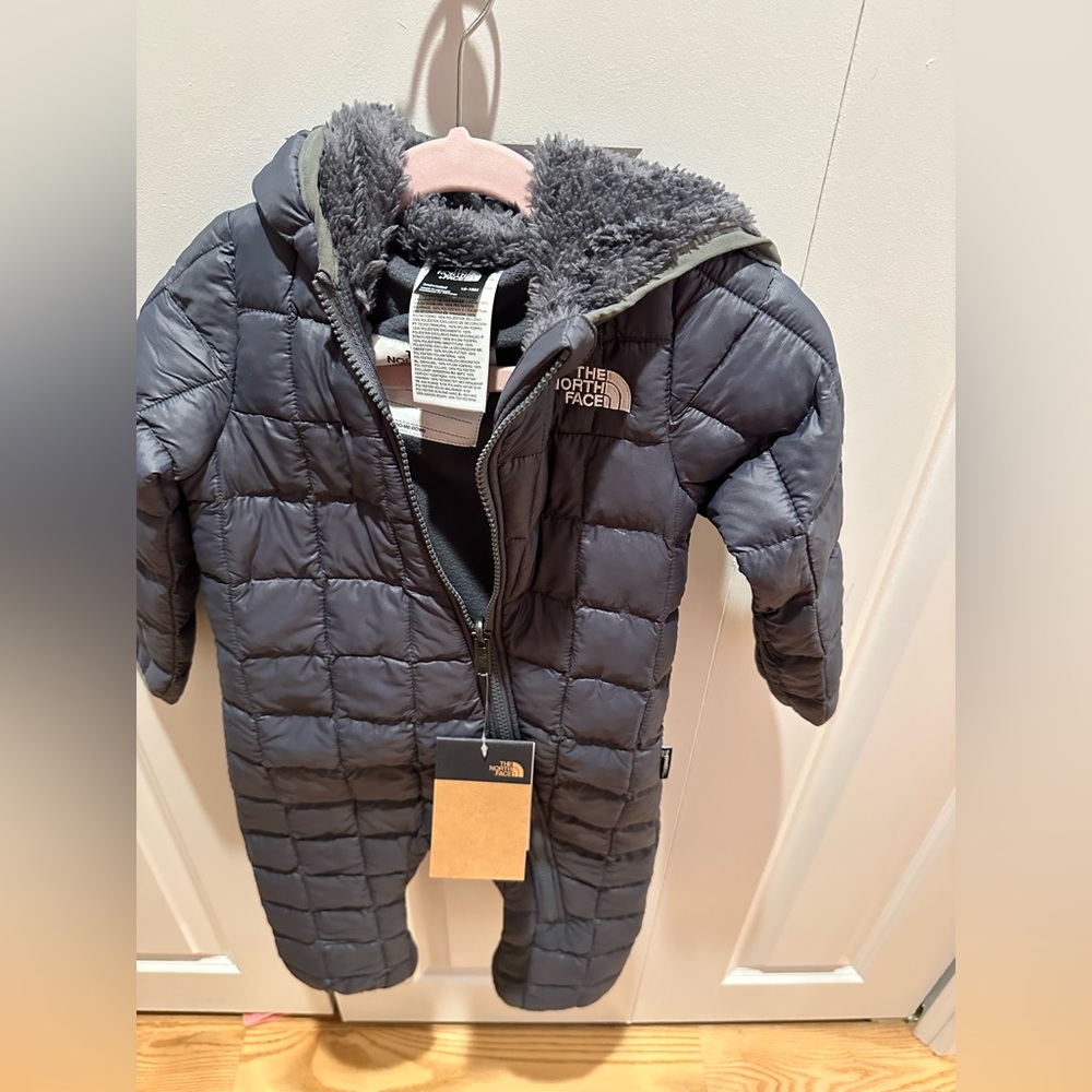NWT. 12-18 month North Face winter/snow suit. This is a one piece.